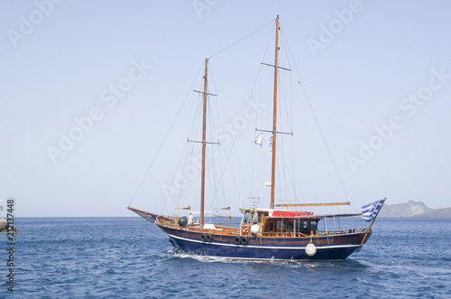 Wooden ship for trip near Santorini island