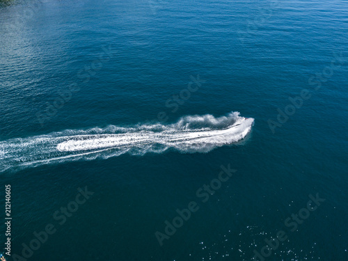 top above view of ski jet waves on the sea water surface