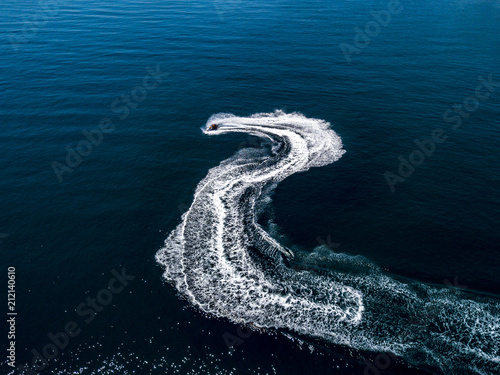 top above view of ski jet waves on the sea water surface