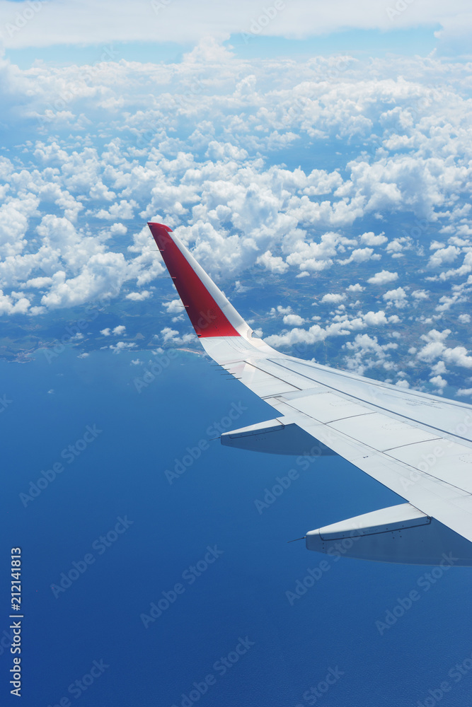 Aerial view of the city and clouds from the aircraft during the flight. Aerial view of the city and clouds from the aircraft during the flight.