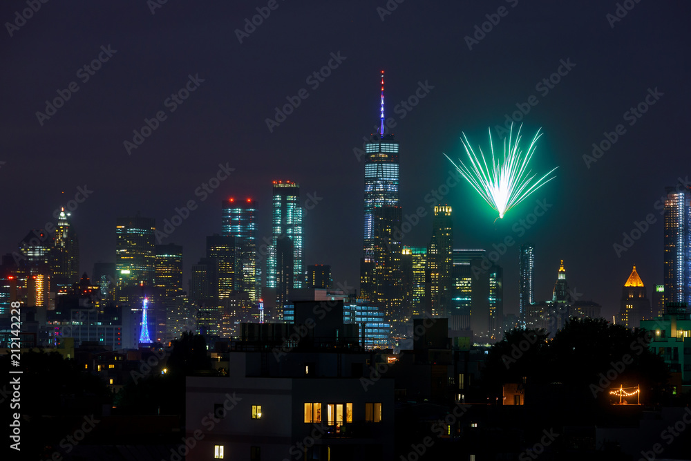NEW YORK CITY - JUL 4: Fireworks over Manhattan seen from Brooklyn