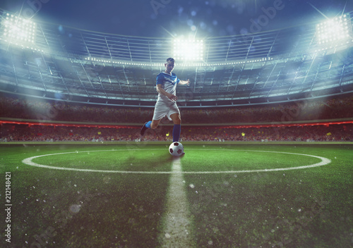 Soccer player hits the ball from the midfield at the stadium