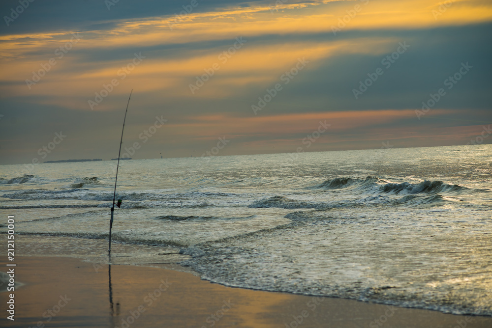 Quiet sunrise on Hilton Head Island Island SC, surf fishing pole
