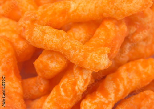 A Background of Long Thin Orange Cheesy Chips