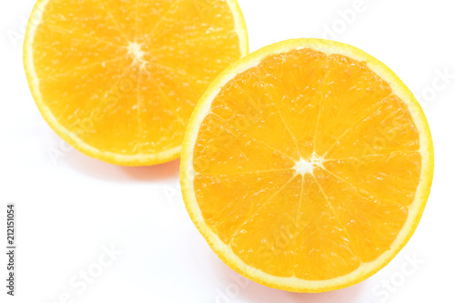 orange cut in half on white background close-up