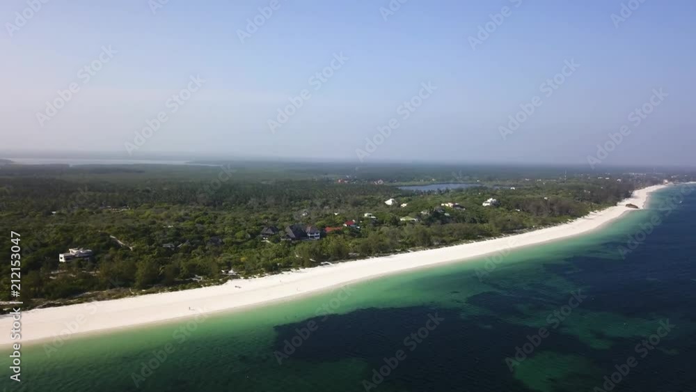 Long beach in Africa/Kenya and beautiful colorfull water filmed by a drone Long beach in Africa/Kenya and beautiful colorfull water filmed by a drone