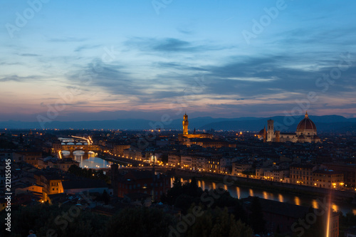 Florence city during sunset. Panoramic view to the river Arno, with Ponte Vecchio, Palazzo Vecchio and Cathedral of Santa Maria del Fiore (Duomo), Florence, Italy