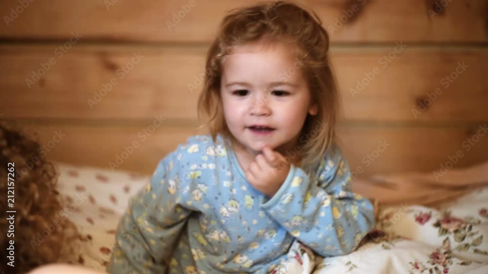 Mother telling story to son at bedtime. Family story bedtime. Pretty young mother teling s night story to her kid Mother telling story to son at bedtime. Family story bedtime. Pretty young mother teling s night story to her kid