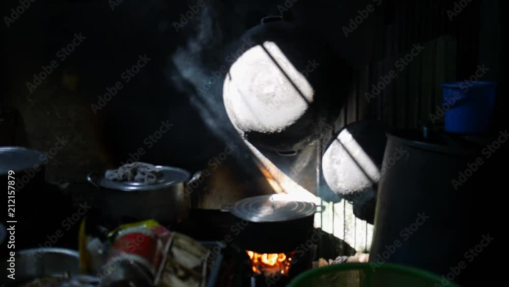 Fire burning on a gas stove in a street market in Phnom Penh, Cambodia.