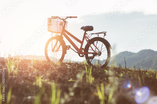 silhouette of bike on mountain at sunset time