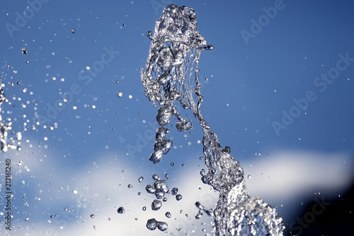 abstract figure of a water fountain on blurred background
