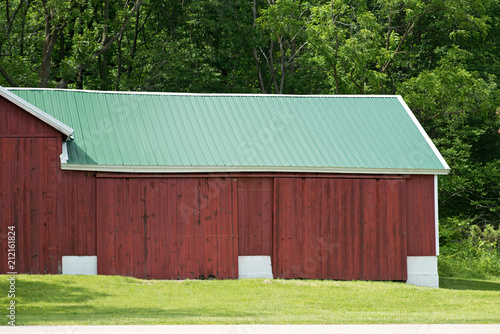 Old red wooden farm barn building for life stock. 