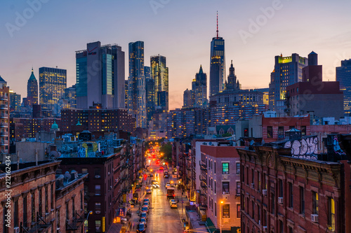 View of Madison Street and Lower Manhattan at sunset from the Manhattan Bridge in New York City