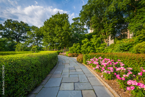 Walkway and flowers at the Conservatory Garden, in Central Park, Manhattan, New York City.