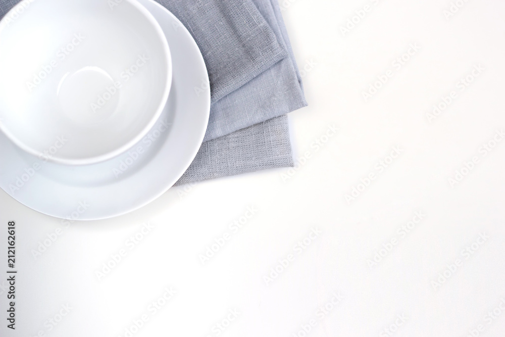 custom made wallpaper toronto digitalEmpty white plate and bowl on a stack of gray napkins on a table.