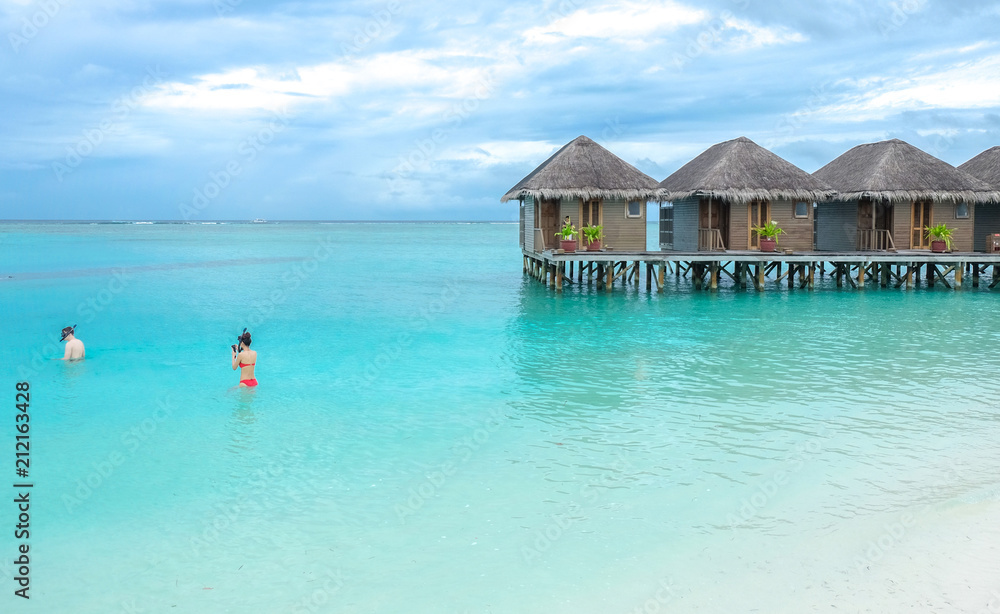 Water villa with blue ocean sea at Maldives island