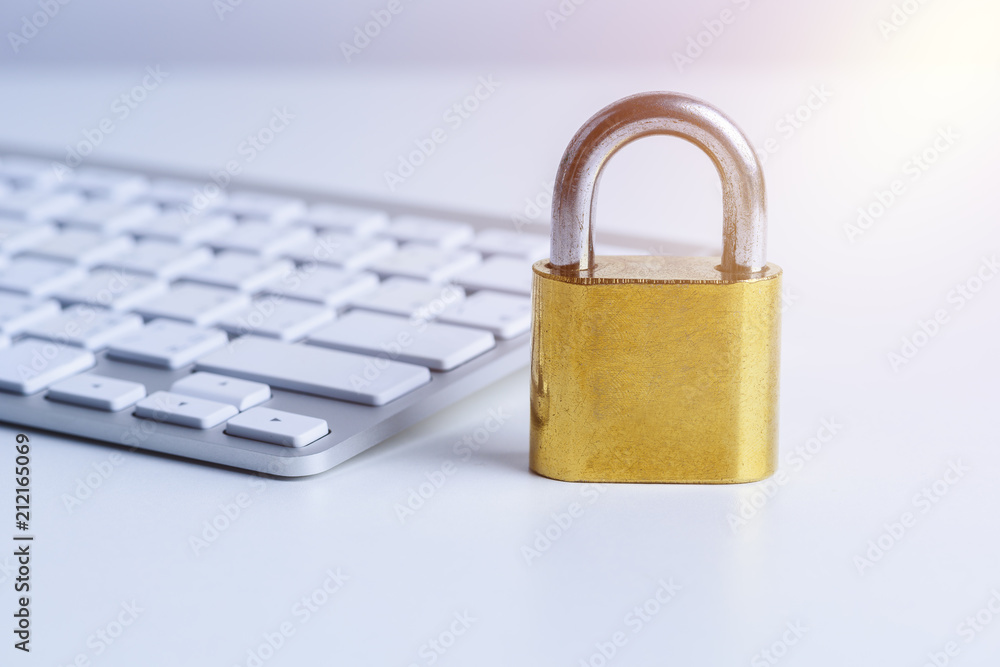 metal security lock on computer keyboard metal security lock on computer keyboard
