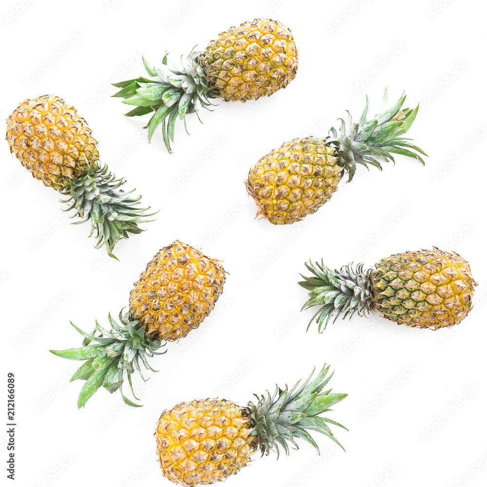 Pineapple fruits on white background. Flat lay, top view. Food concept. Pineapple fruits on white background. Flat lay, top view. Food concept.
