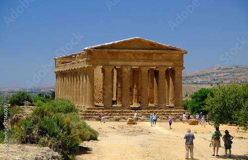 Tourists at a temple in the Valley of Temples, Agrigento, Sicily