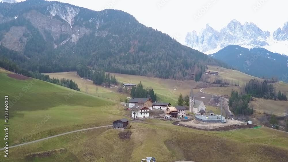 Italian church aerial in the dolomites and alps orbit flyover Italian church aerial in the dolomites and alps orbit flyover