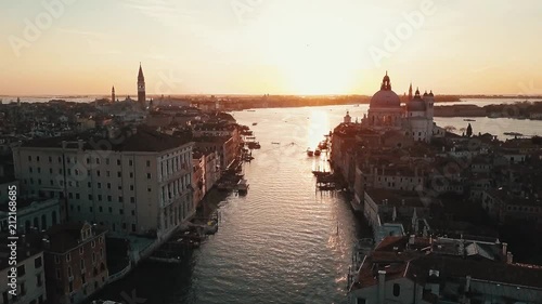 aerial flight thru venice canal at sunrise in italy