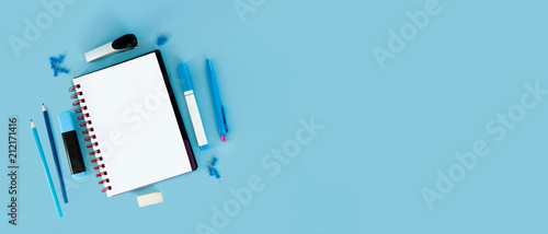 Blue background and blue school supplies. Back to school. Flat lay.  Creative Idea of education for banners. Sale posters.  Blue background with copy space.