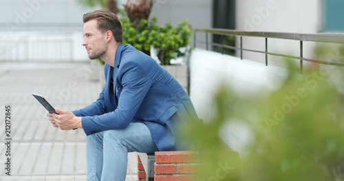 Photography Caucasian Businessman use of tablet computer