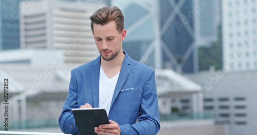 Canvas Print Caucasian Businessman use of tablet computer