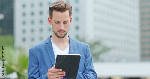 Photography Businessman work on digital tablet at outdoor