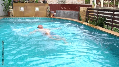 In the swimming pool at floating man photo