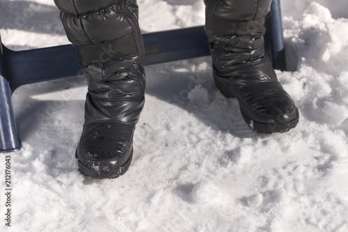 Legs in weatherproof boots