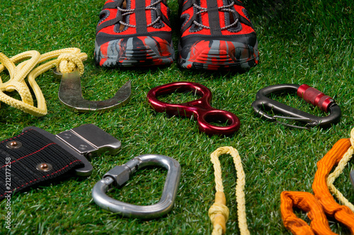 on the green lawn, a set of items for tourism and protective shoes for outdoor activities.