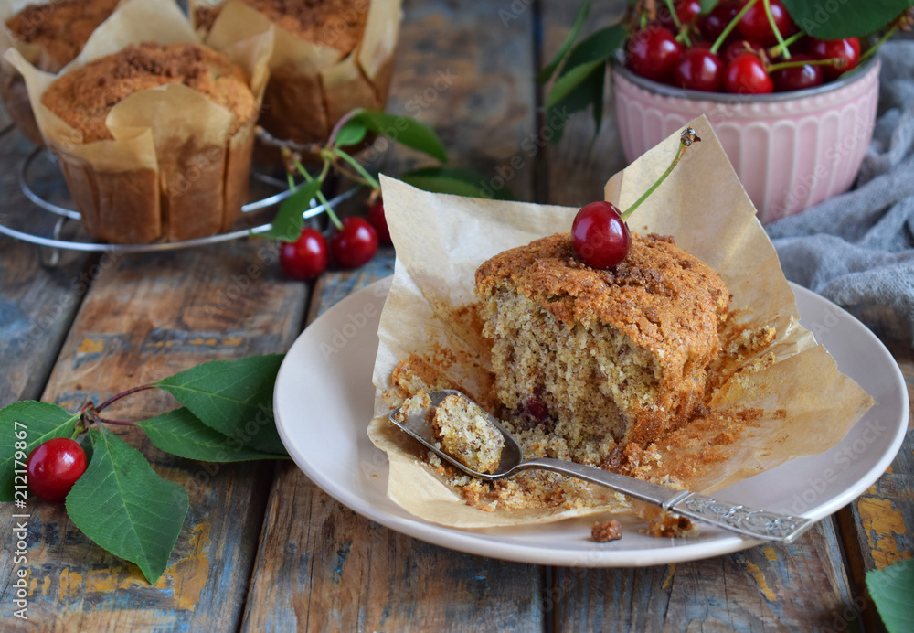 Muffin from flax seeds, millet and rice flour with cherries. Gluten-free cake. Healthy pastries. Rustic photo. Copy space Muffin from flax seeds, millet and rice flour with cherries. Gluten-free cake. Healthy pastries. Rustic photo. Copy space
