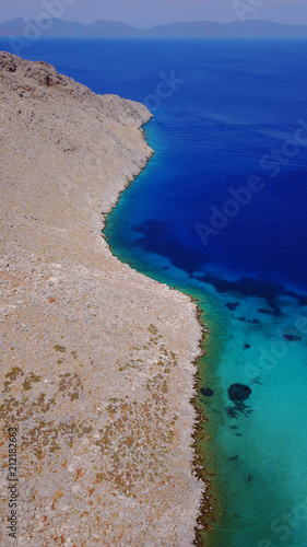 Aerial birds eye view photo taken by drone of famous tropical rocky beach of Agia Marina, Symi island, Dodecanese, Greece