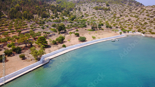 Aerial birds eye view photo taken by drone of famous tropical rocky beach of Agios Georgios with yachts docked  Symi island  Dodecanese  Greece