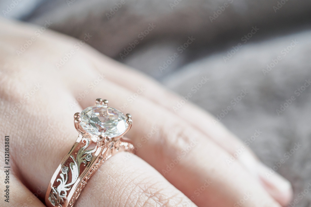 Obraz premium woman hand with jewelry diamond ring on finger