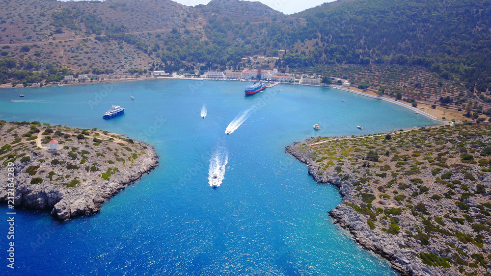 Aerial bird's eye view photo taken by drone from bay and iconic Monastery of Panormitis, Symi island, Dodecanese, Greece
