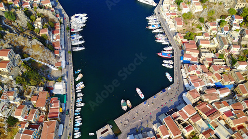 Aerial brid's eye photo taken by drone of Yalos, iconic port of Symi island, Dodecanese, Greece photo