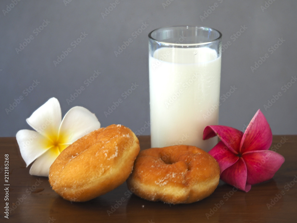 Bakery and milk ..Homemade donuts sprinkled with powdered sugar Bakery and milk ..Homemade donuts sprinkled with powdered sugar