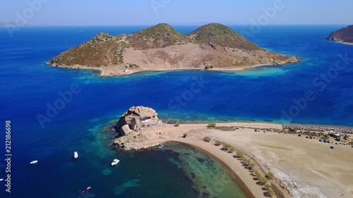 Fototapeta Naklejka Na Ścianę i Meble -  Aerial birds eye view photo taken by drone of famous rock of Kalikatsou in Petra beach, Patmos island, Dodecanese, Greece