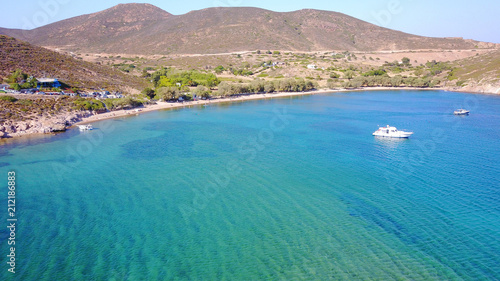 Fototapeta Naklejka Na Ścianę i Meble -  Aerial bird's eye view photo taken by drone of famous rocky beach of Livadi Geranou with turquoise clear waters, Patmos island, Greece