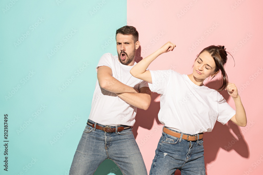 A couple of young man and woman dancing hip-hop at studio. A couple of young man and woman dancing hip-hop at studio.
