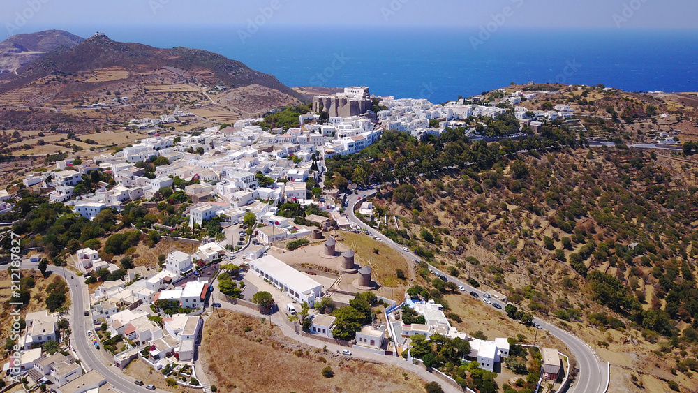 Aerial bird's eye view photo taken by drone of massive fortified stone Monastery of Saint John the Apostle with views to Aegean sea, Patmos island, Greece
