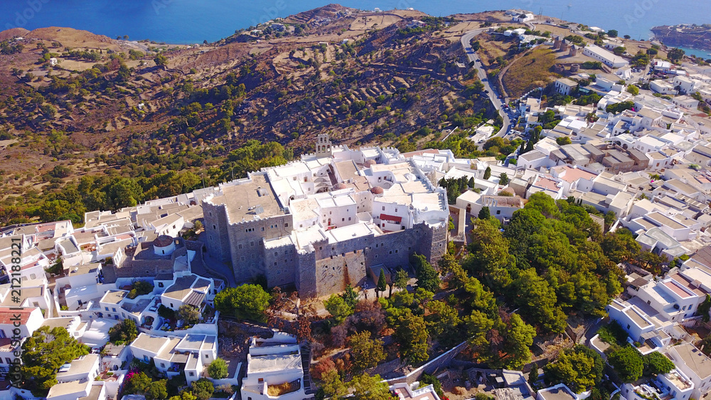 Aerial bird's eye view photo taken by drone of Massive fortified stone Monastery of Saint John the Apostle, Patmos island, Greece