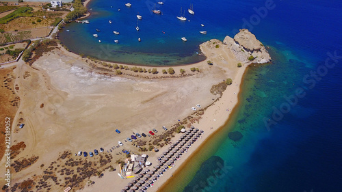 Aerial birds eye view photo taken by drone of famous rock of Kalikatsou in Petra beach, Patmos island, Dodecanese, Greece photo