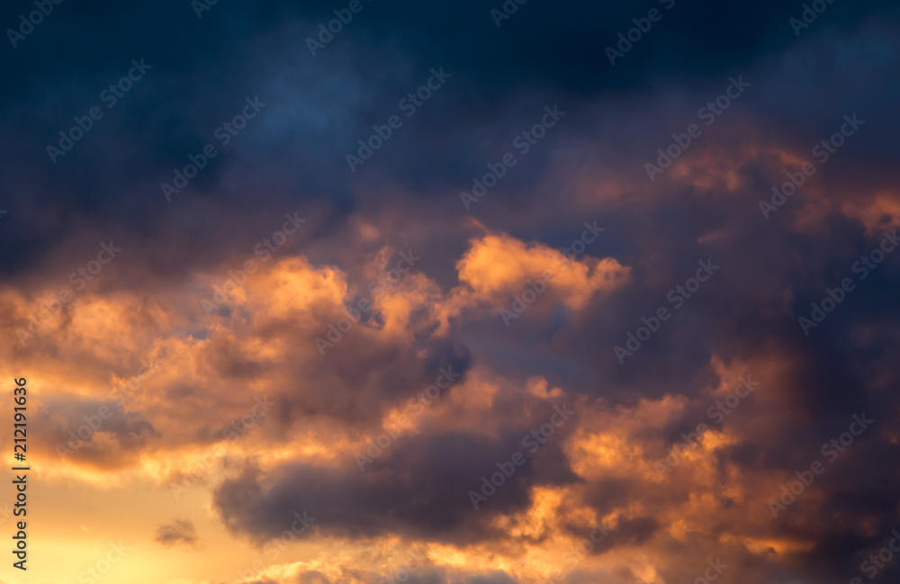 Storm clouds at sunset, dramatic sky