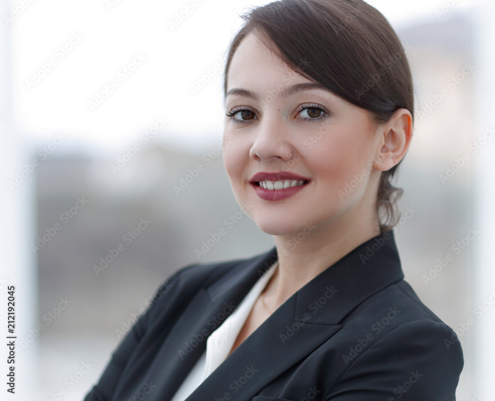 successful young business woman on the background of the office. successful young business woman on the background of the office.