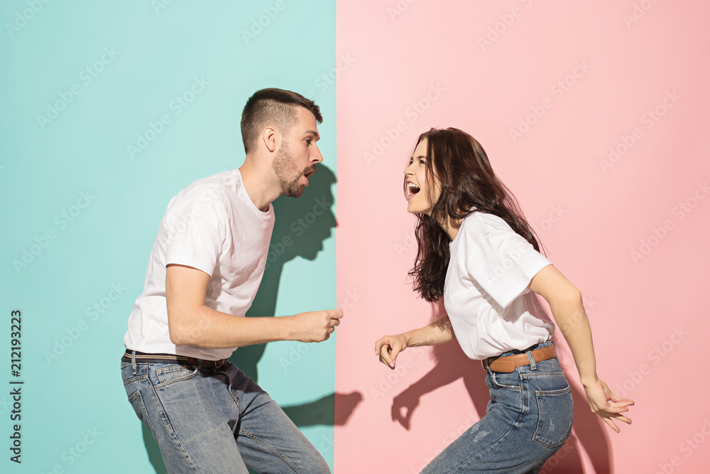 A couple of young man and woman dancing hip-hop at studio. A couple of young man and woman dancing hip-hop at studio.