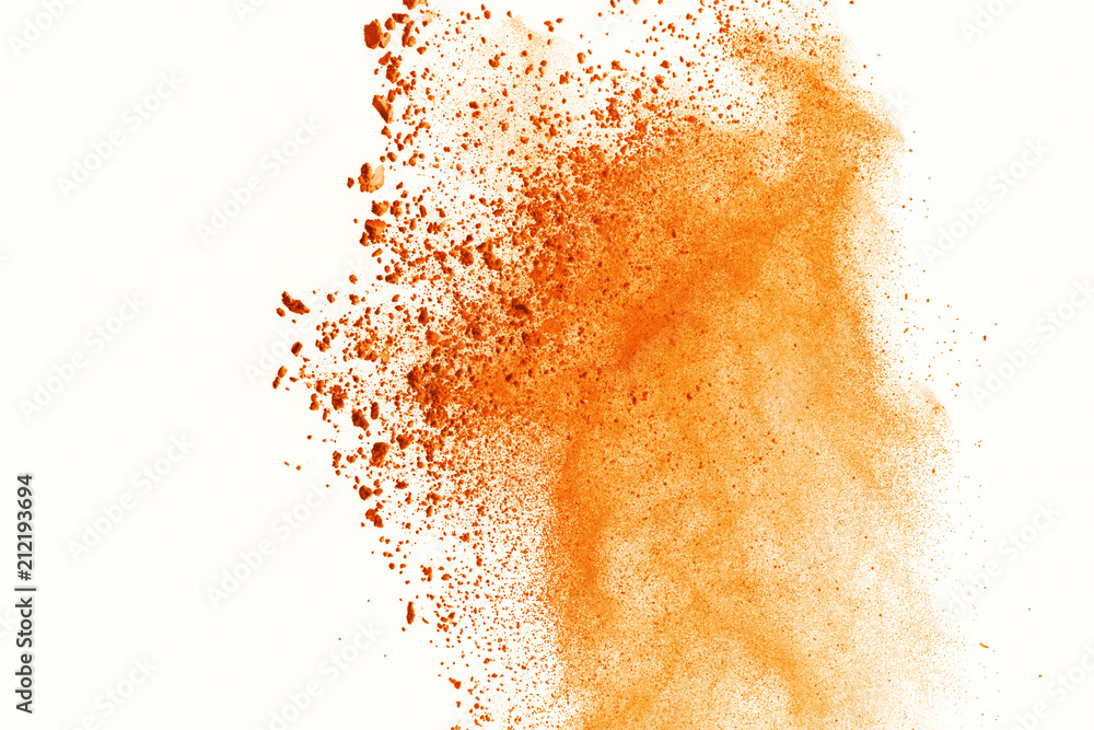 Explosion of colored powder on white background. Orange colored of dust