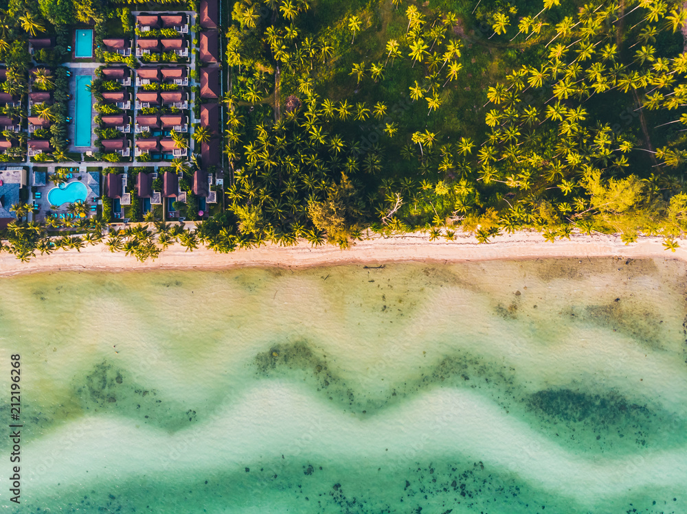 Aerial view of beautiful tropical beach and sea with trees on island